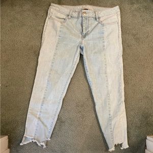 Asymmetrical hem light wash jeans